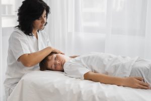 female-osteopathist-treating-boy